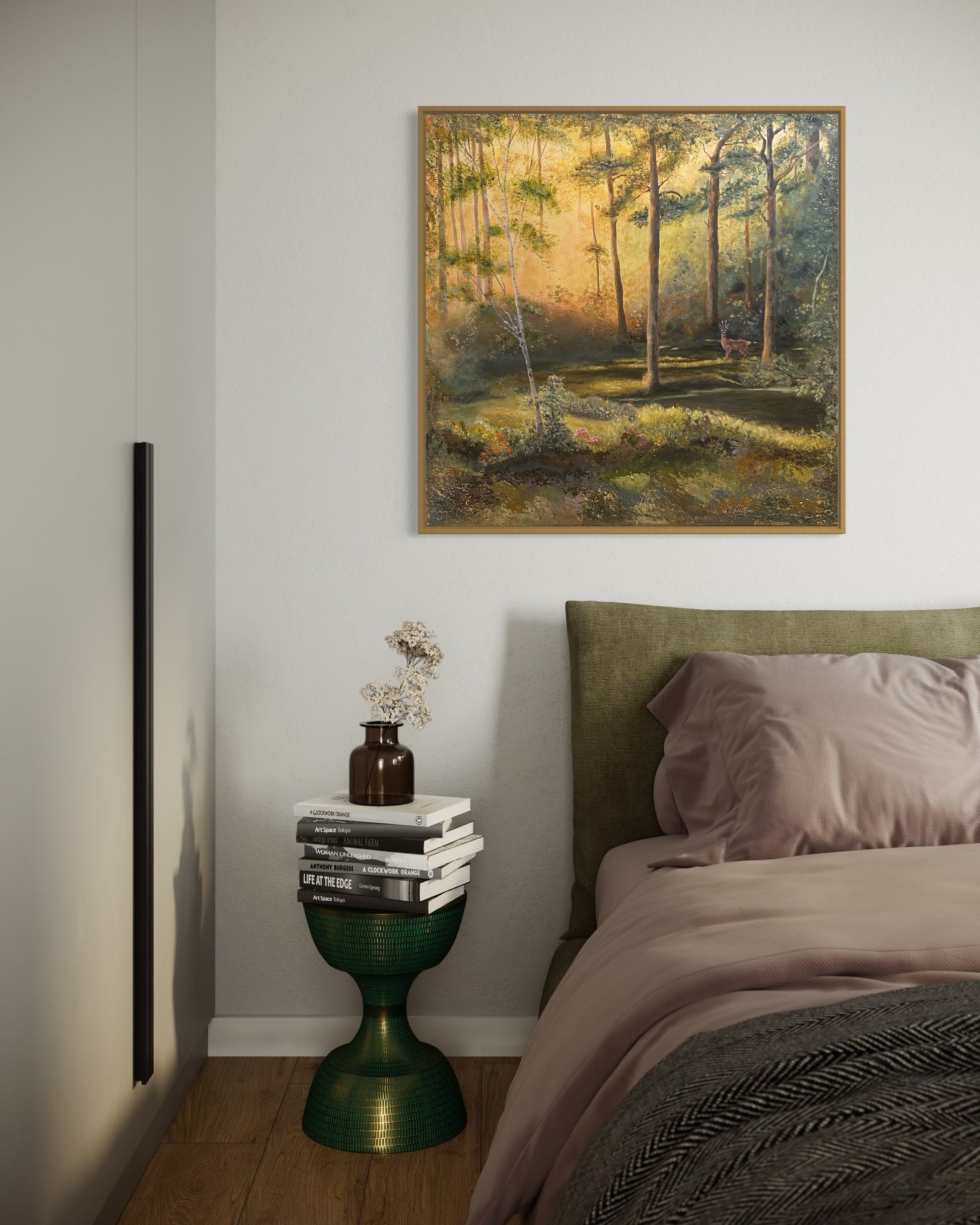 Bedroom with a painting of a forest on the wall, a bed with green headboard, and a small table with decorative items.