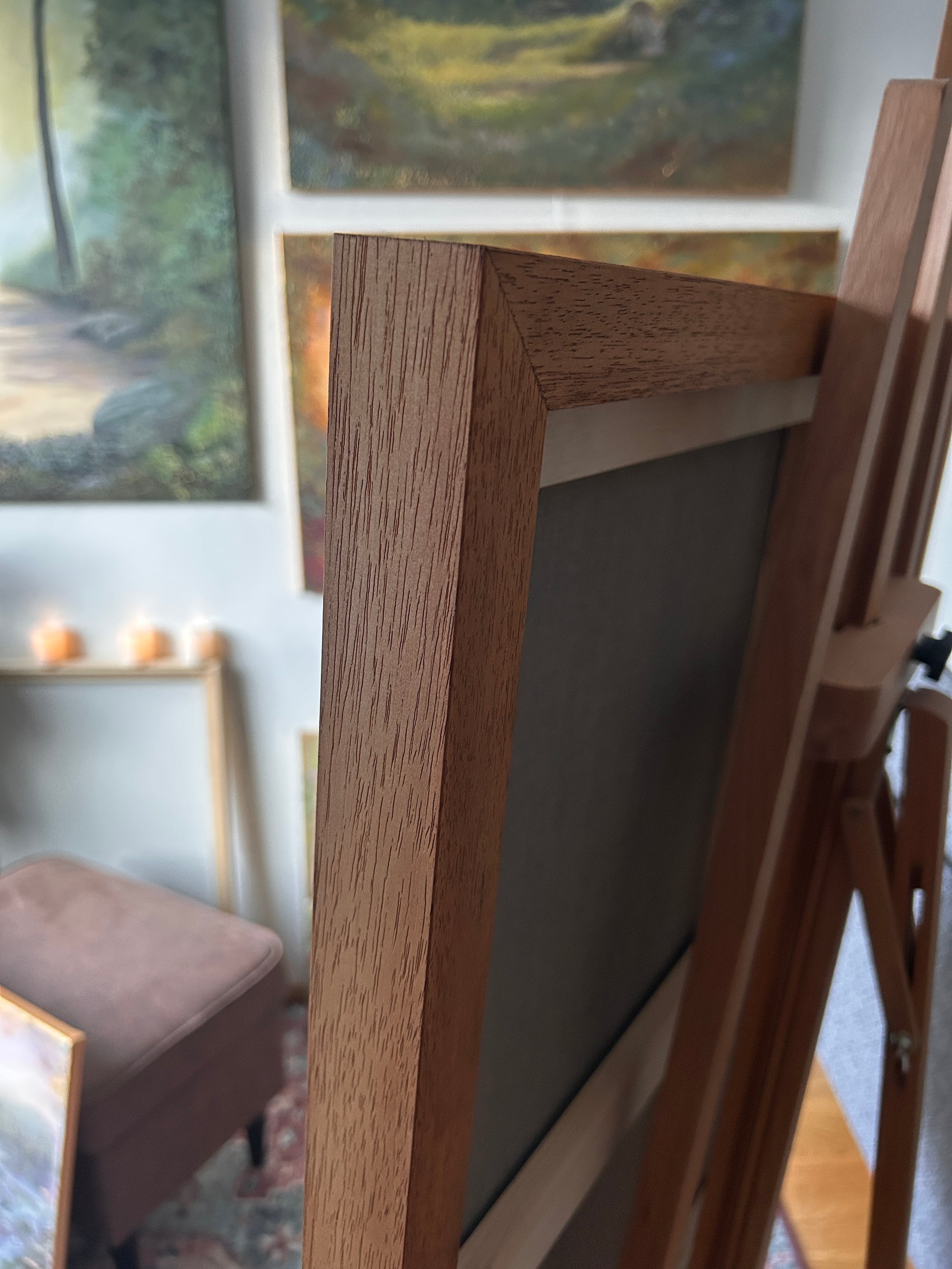 Close-up of a wooden picture frame with blurred background